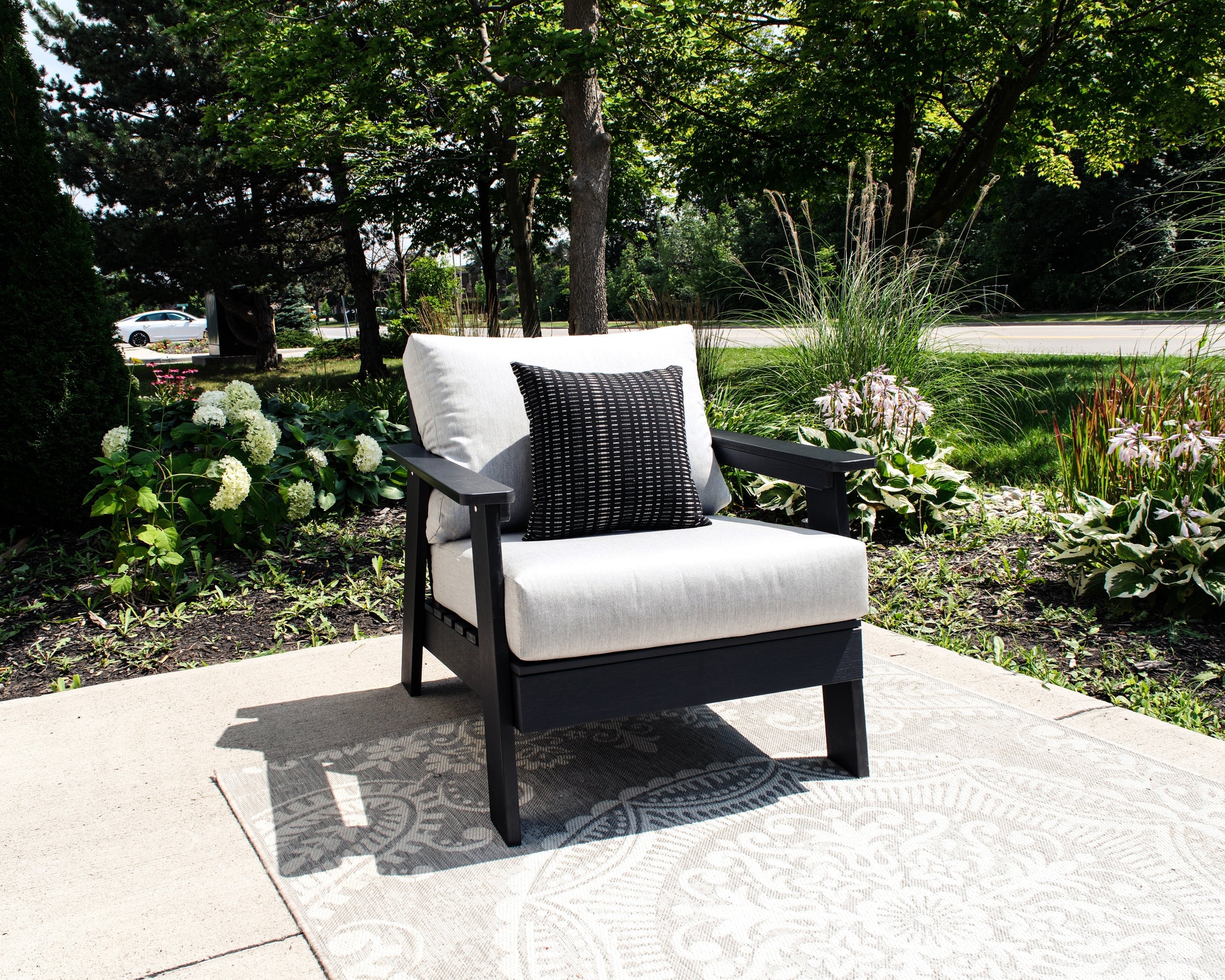 Hazelnut Black Polymer Lounge Chair with Sunbrella® Cushion